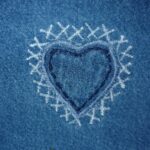 an embroided heart in blue denim