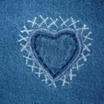 an embroided heart in blue denim
